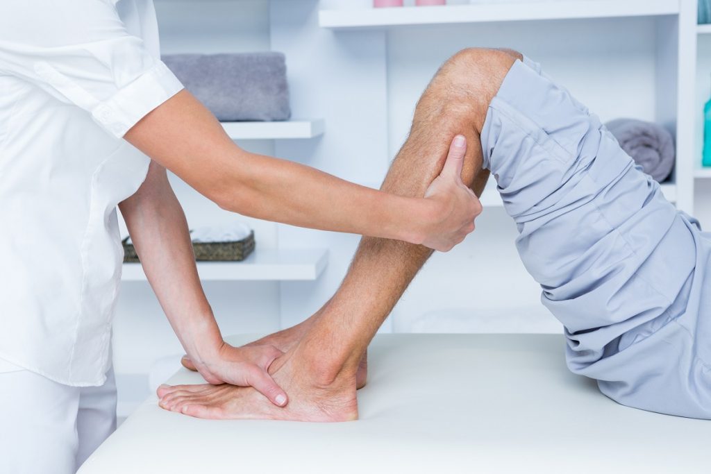 Physiotherapist doing a calf massage