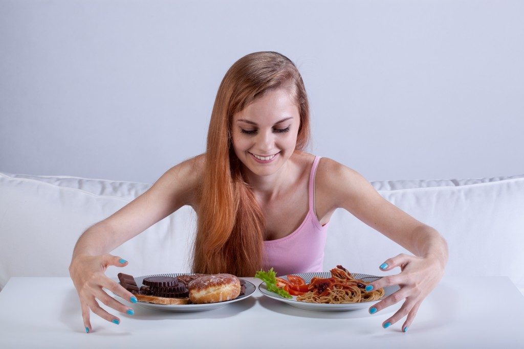 woman eating a lot of food