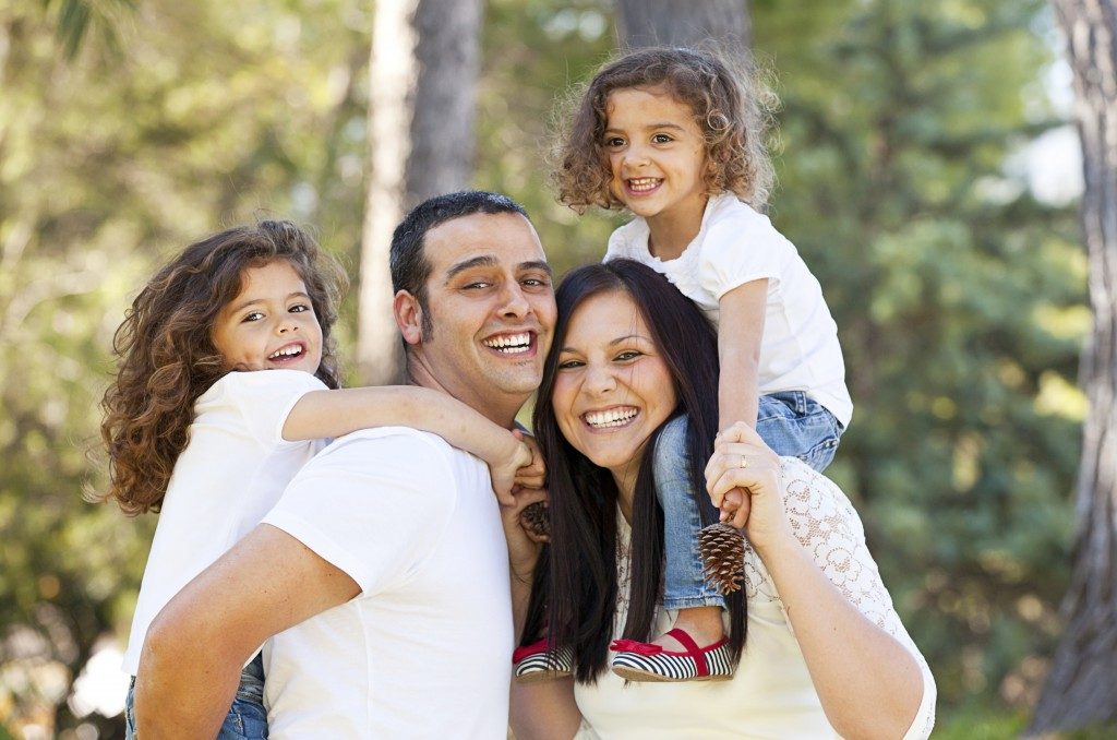 married couple with two young daughters