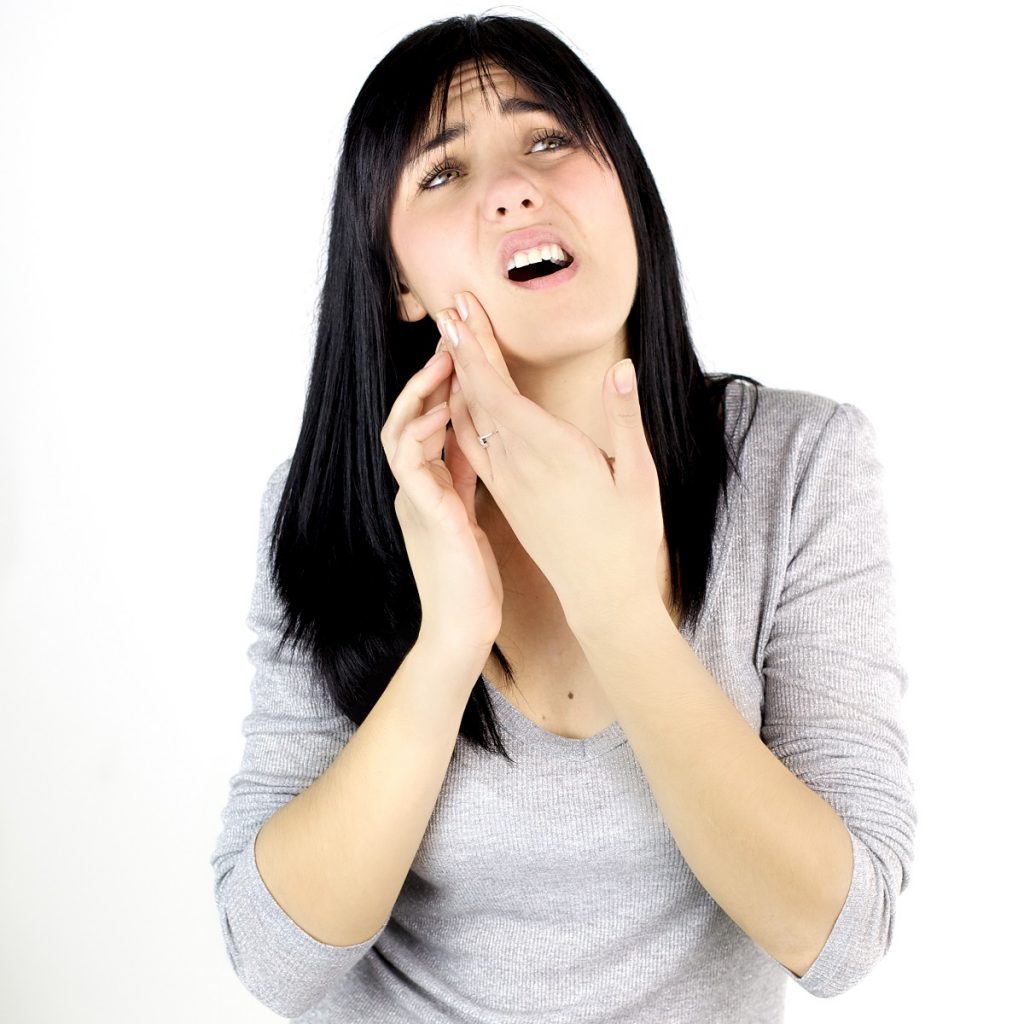 woman having pain from toothache