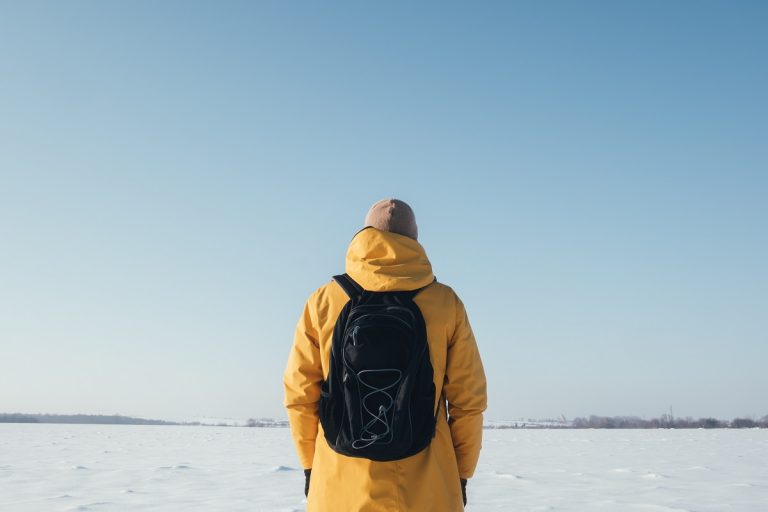 Alone traveler in yellow jacket