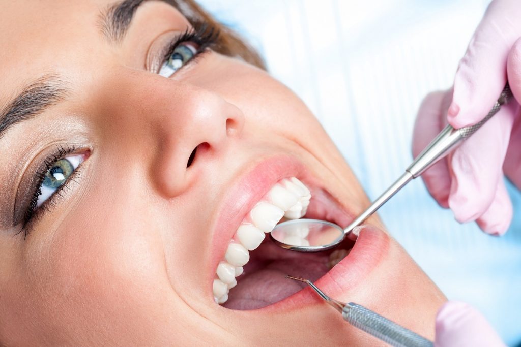 woman having her teeth checked