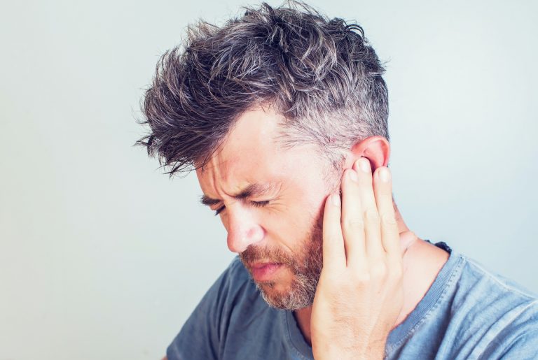 man having sore ears