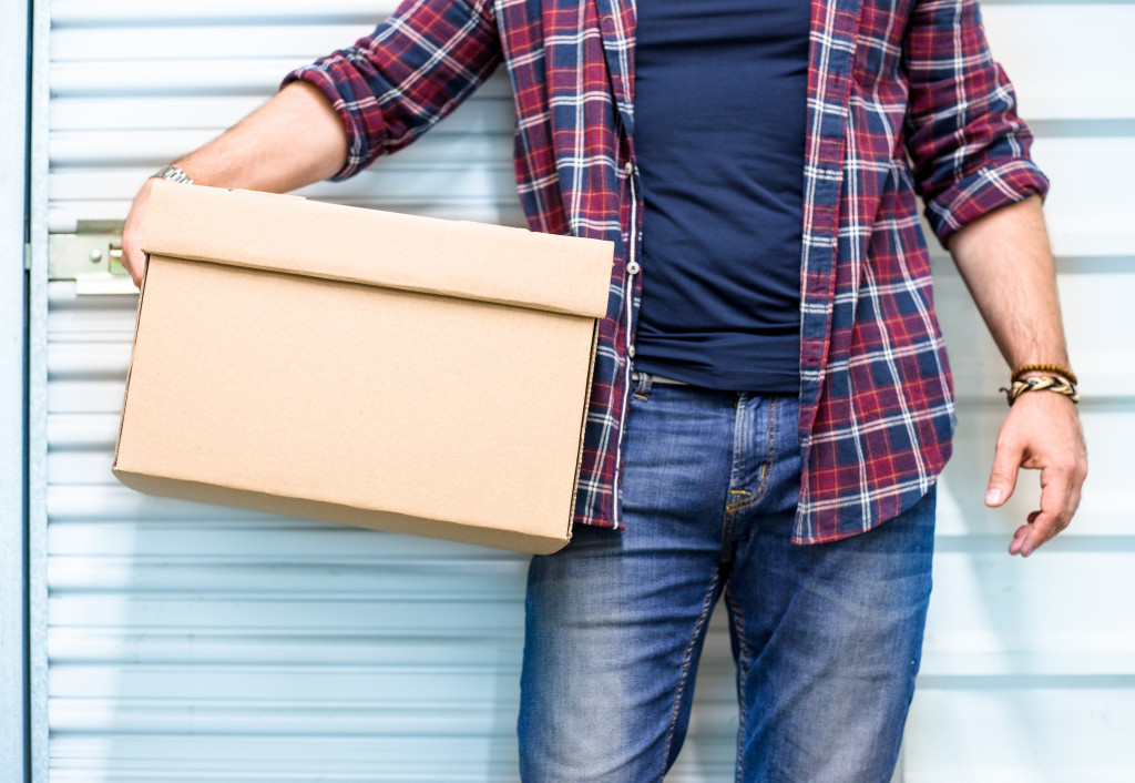 man with storage box