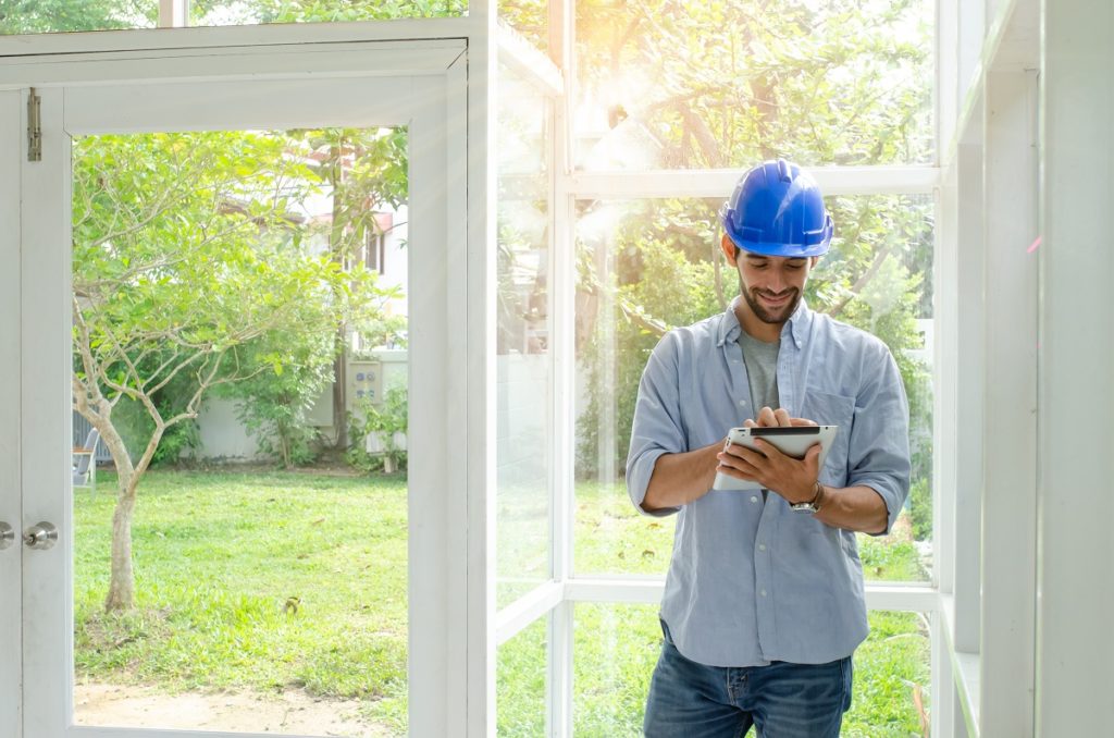 man inspecting home