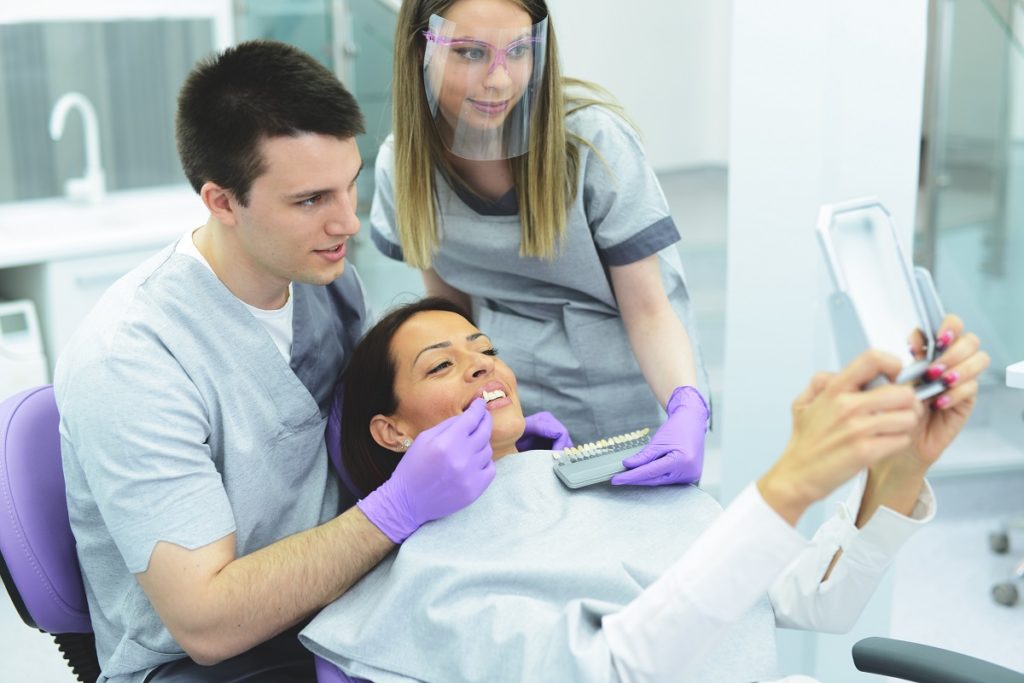dentist explaining the procedure to his patient