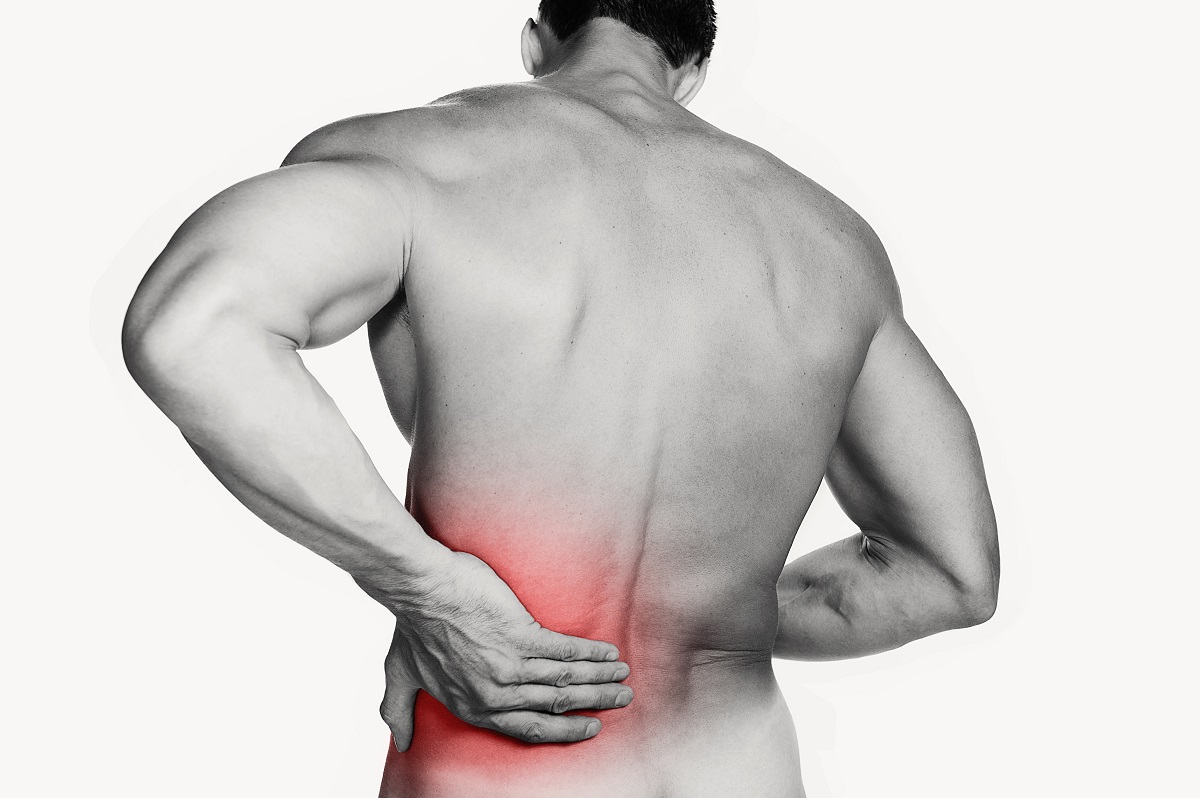 man suffering from back pains