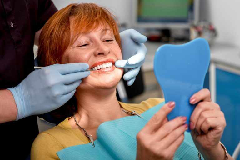 smiling woman at the dental clinic