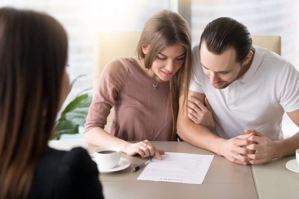 couple reading an insurance policy