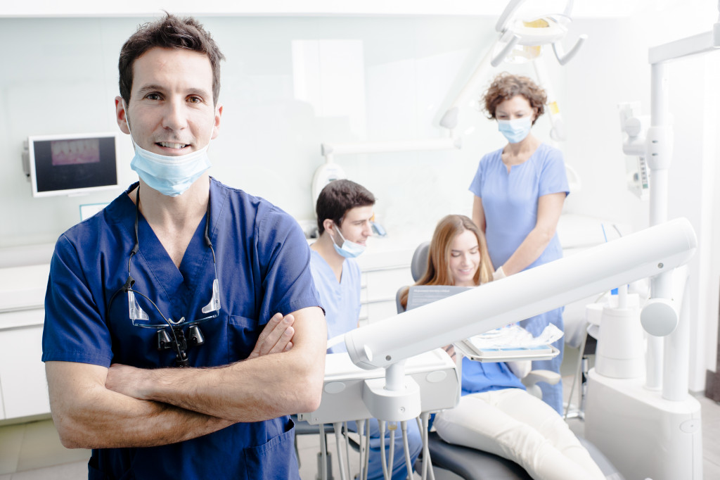 dentist with his team