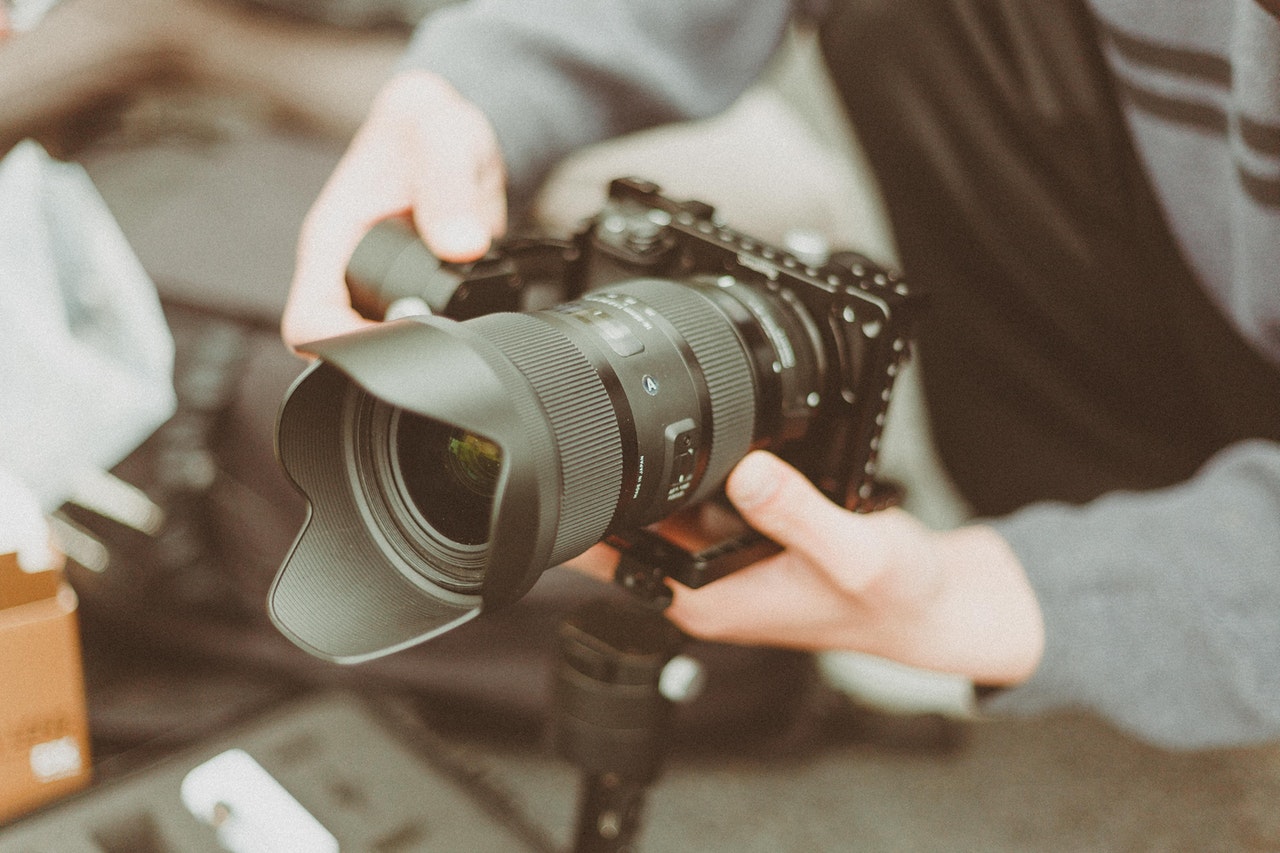 holding a camera at a low angle