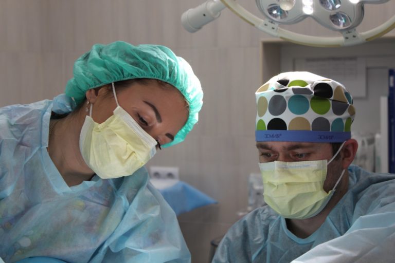 surgeons operating on a patient