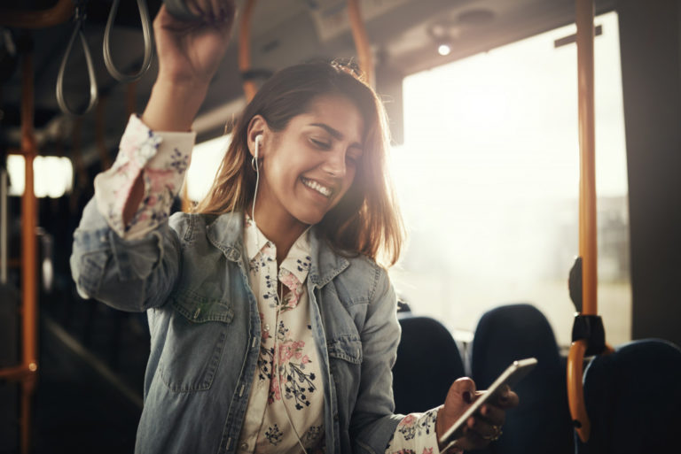 woman listening to music while in transit