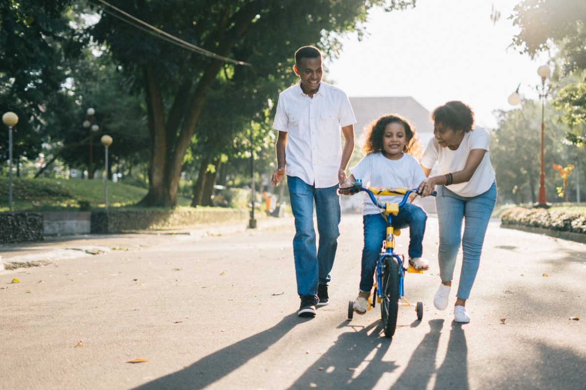 child learning to ride a bike