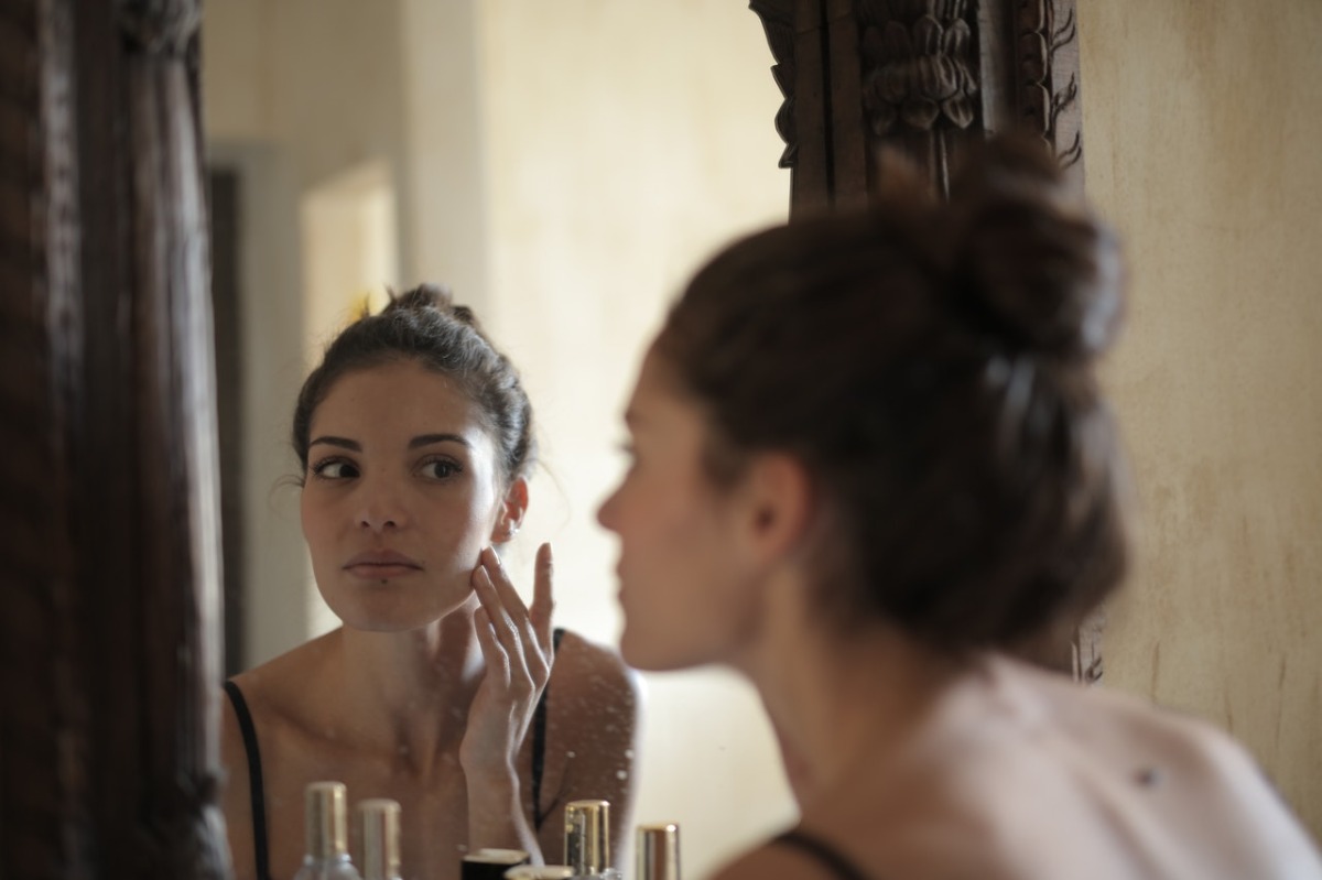 woman in front of a mirror