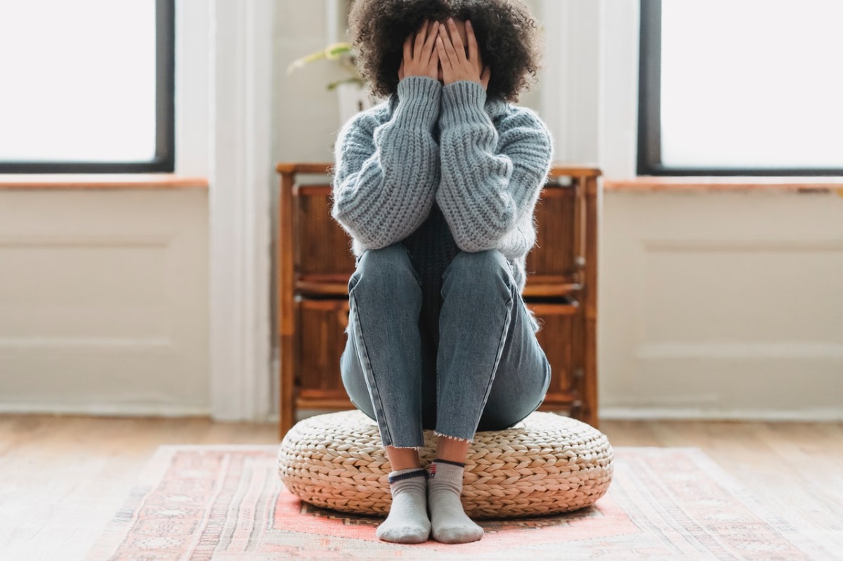 woman hiding her face