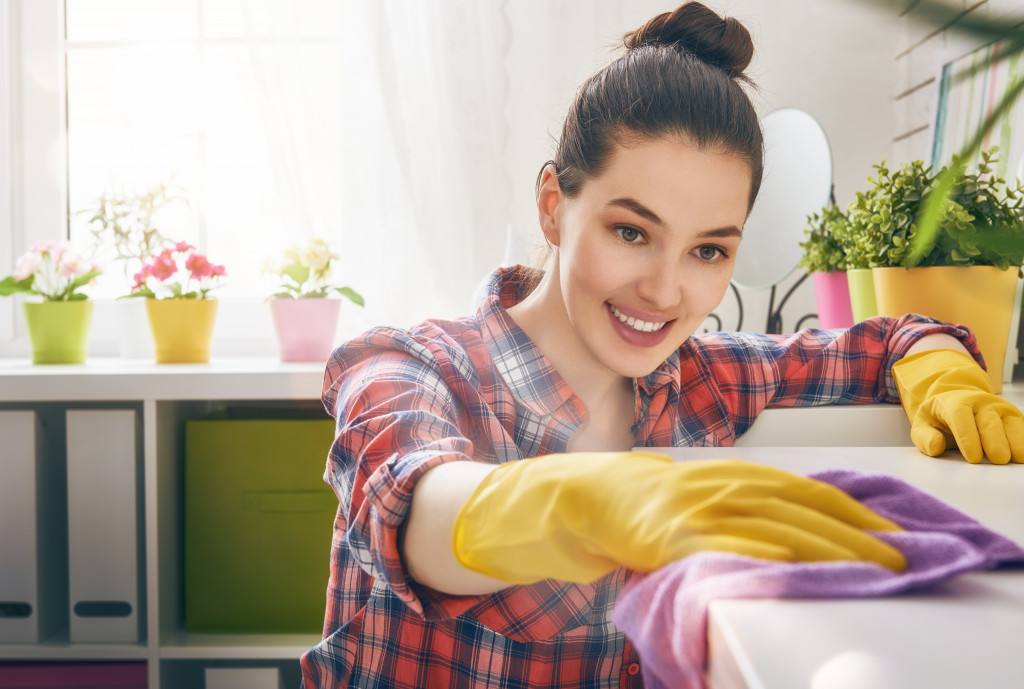 woman cleaning counter