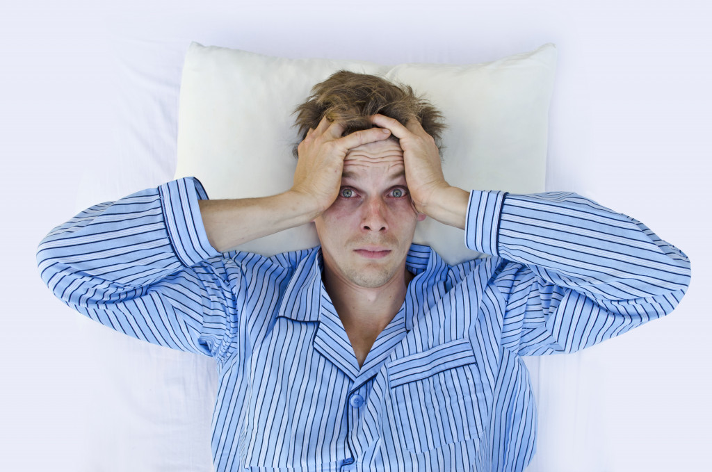 man having trouble sleeping