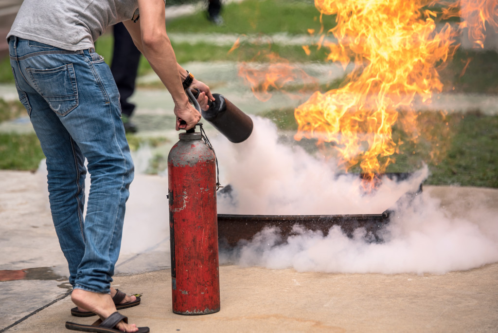 A man holding a fire-retardant