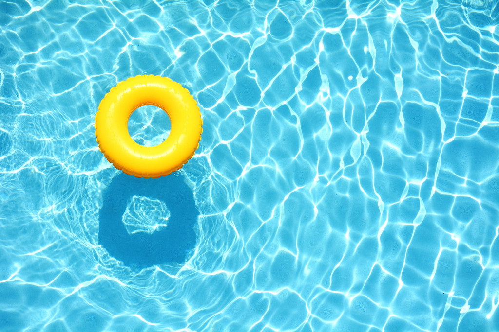 a swimming pool with a yellow floater