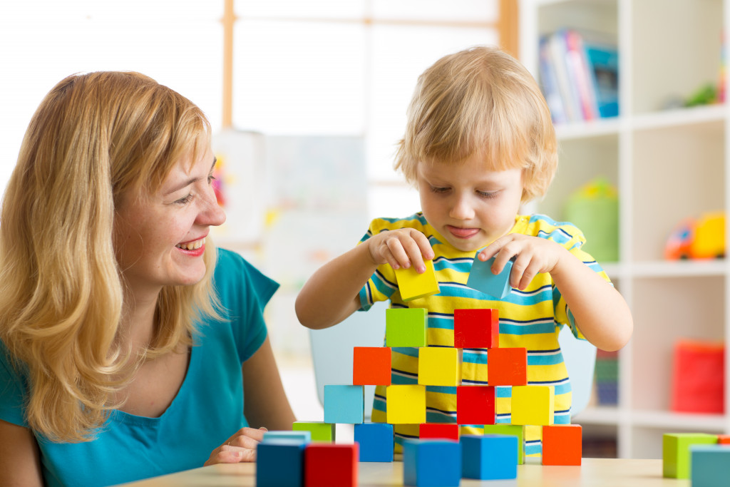 a mother and child smiling