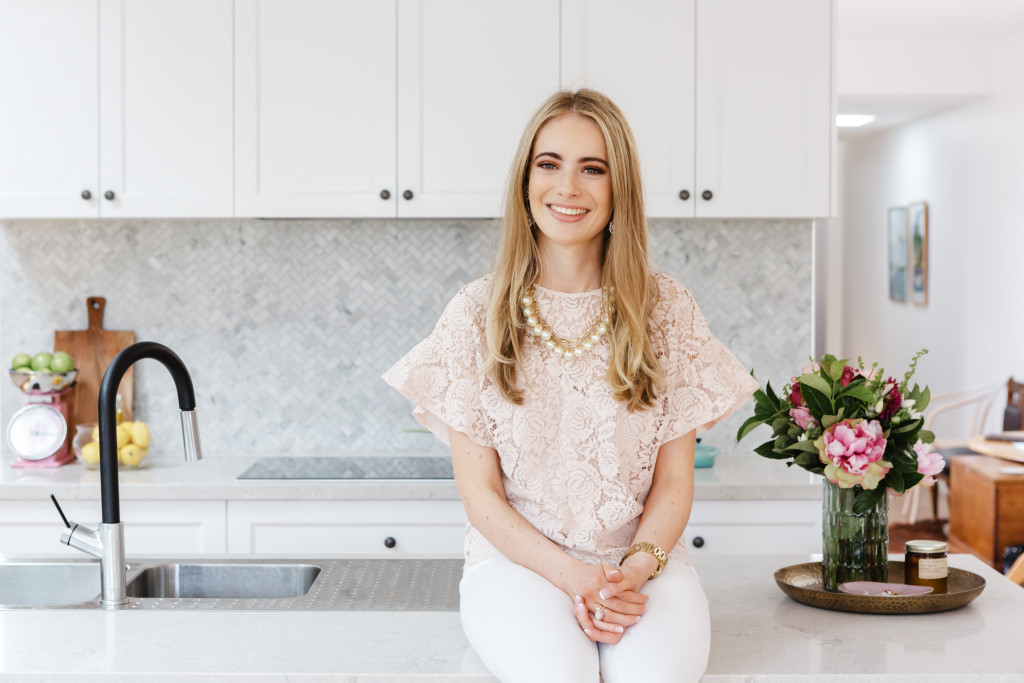 woman sitting in her kitchen