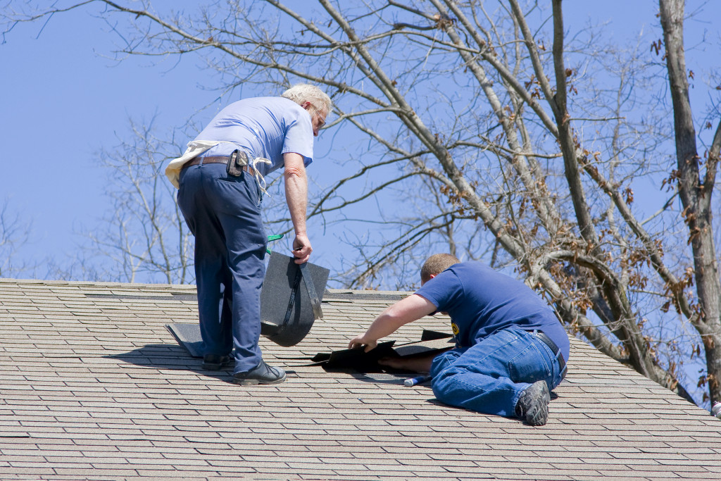 men fixing the roof