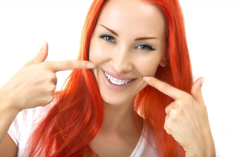 orange haired woman smiling