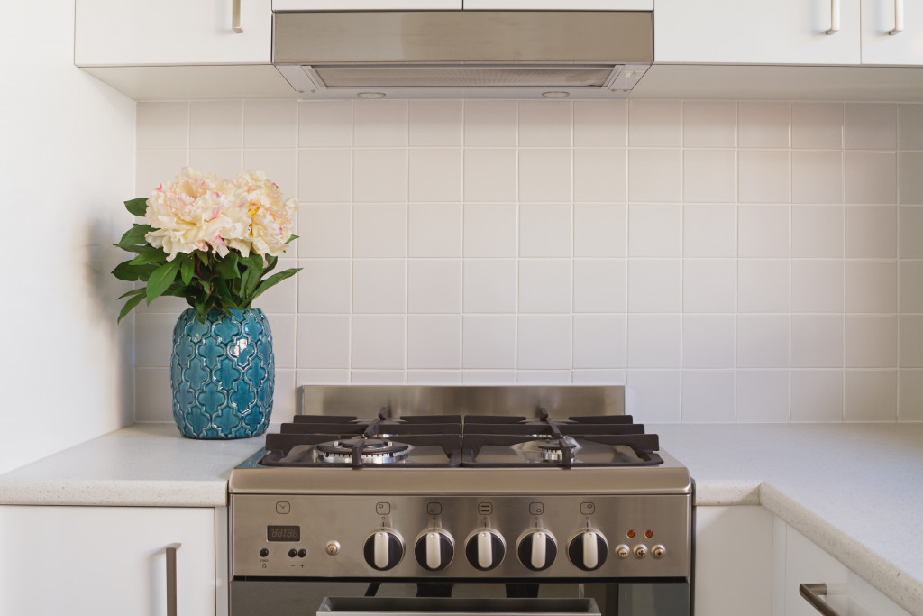 New stove and hood installed in kitchen