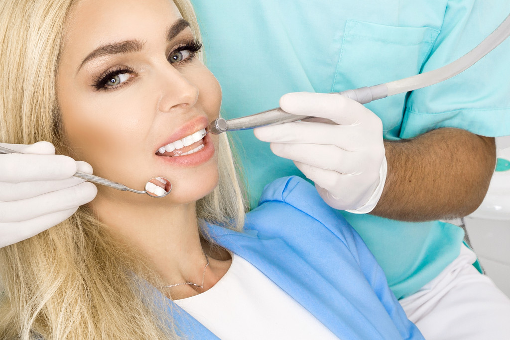 dentist checking patients teeth