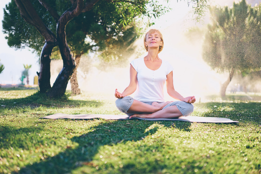 Portrait of a old woman doing meditation in mark 