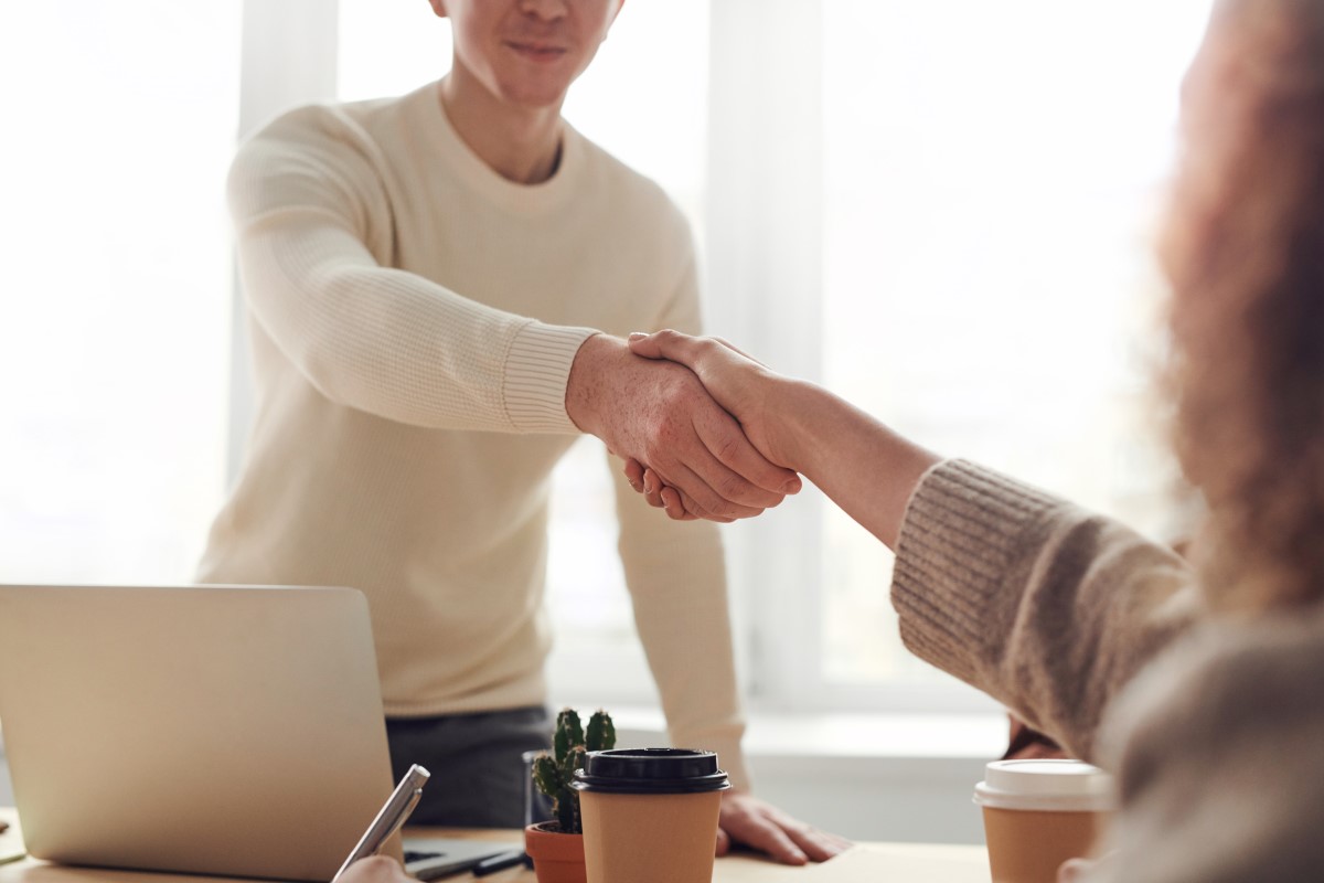 woman hand shaking in an interview