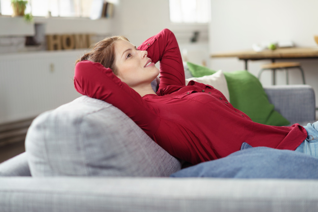relaxed woman sitting at home