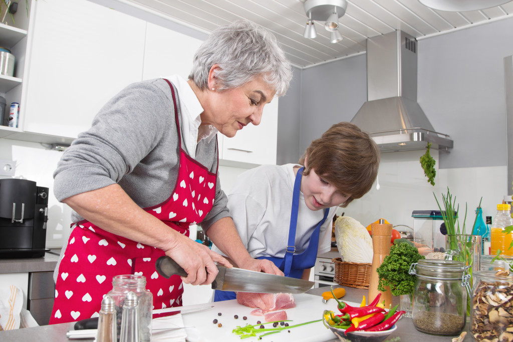 grandson and grandmother cooking together