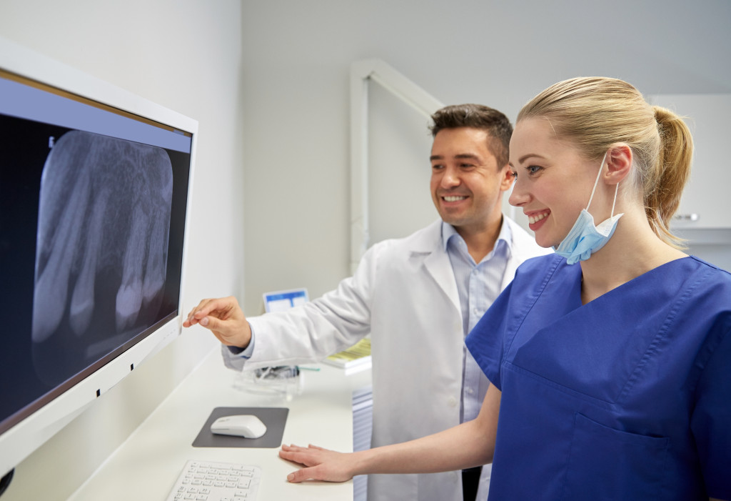 A clinic doctor and nurse in X ray room